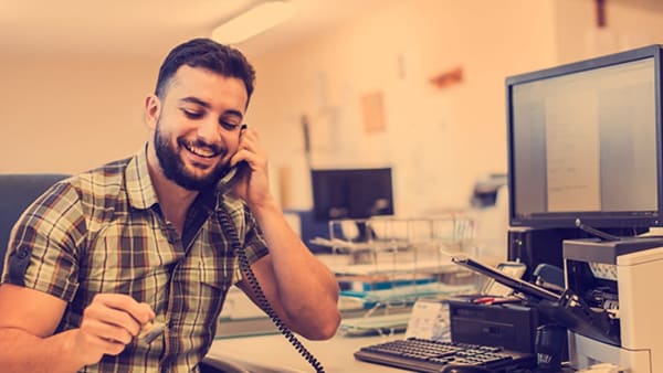 A man on the phone in an office